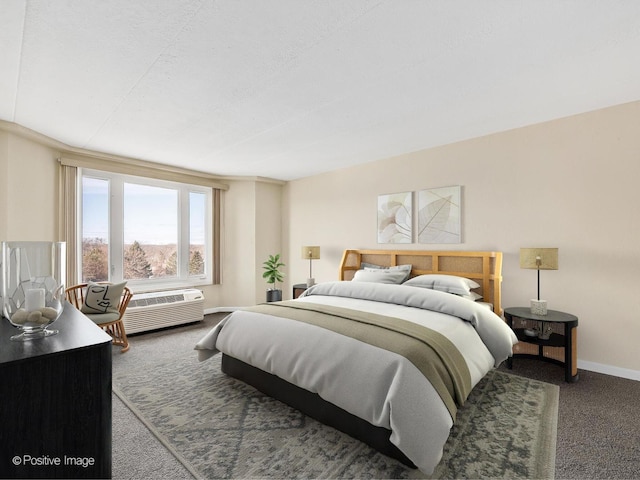 bedroom with a wall mounted air conditioner and dark carpet