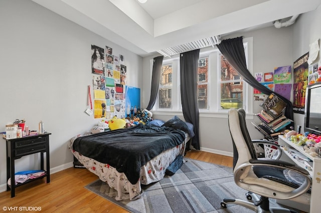 bedroom with wood-type flooring