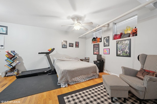 bedroom with wood-type flooring and ceiling fan