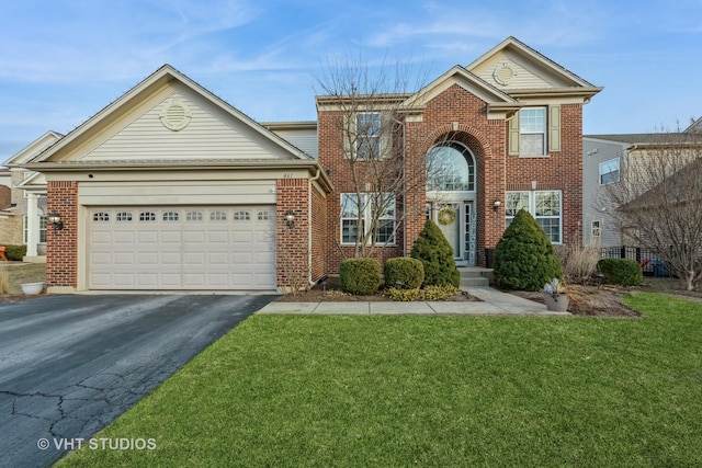 view of front property with a garage and a front lawn