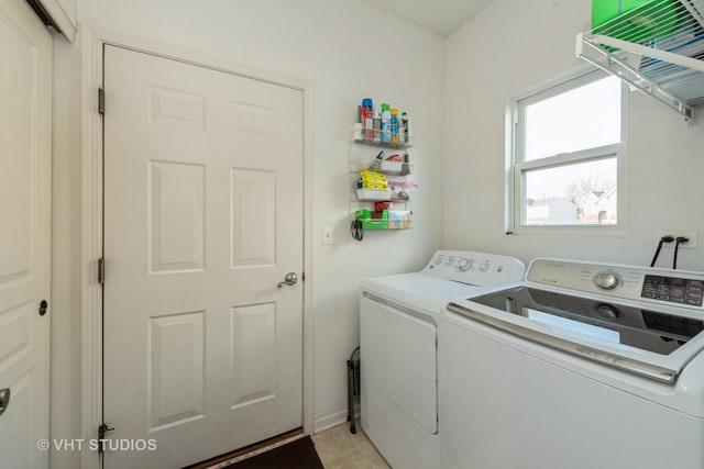 laundry area featuring light tile patterned floors and separate washer and dryer