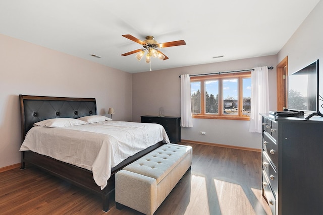 bedroom featuring dark hardwood / wood-style floors and ceiling fan