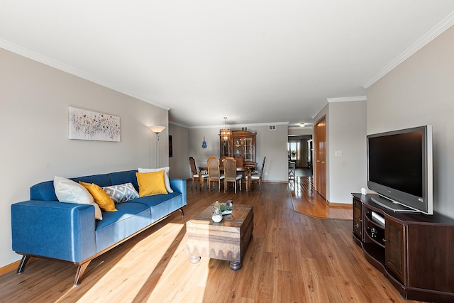 living room featuring crown molding and wood-type flooring