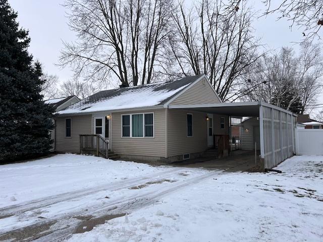 exterior space with a carport