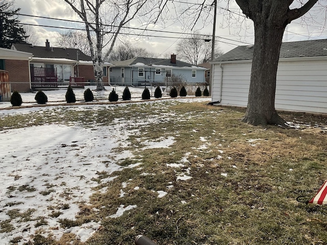 view of yard covered in snow