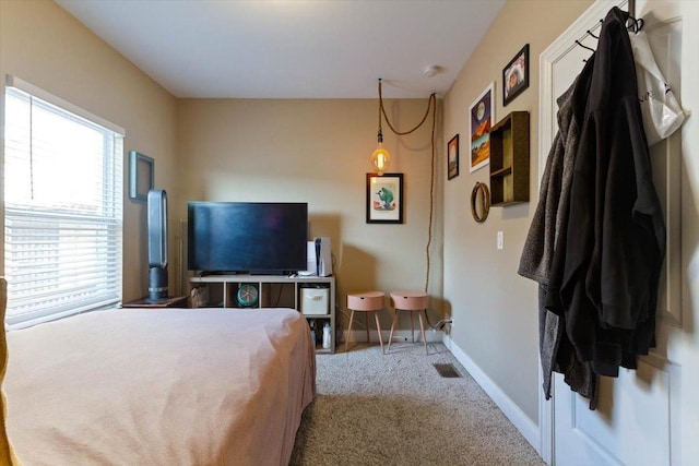 bedroom featuring light carpet