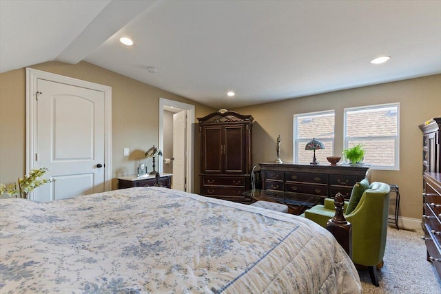 bedroom featuring carpet floors and lofted ceiling