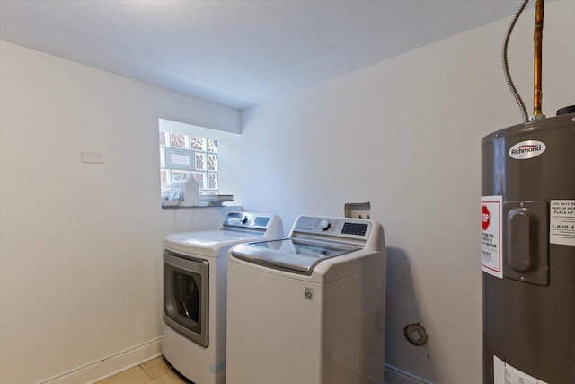 laundry room featuring washing machine and dryer and electric water heater