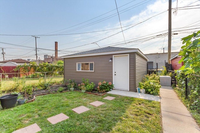 view of outbuilding featuring a lawn