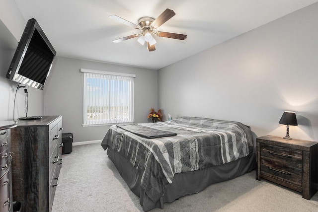 bedroom featuring light carpet and ceiling fan