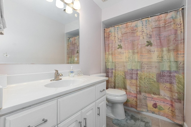 bathroom featuring vanity, a shower with shower curtain, tile patterned floors, and toilet