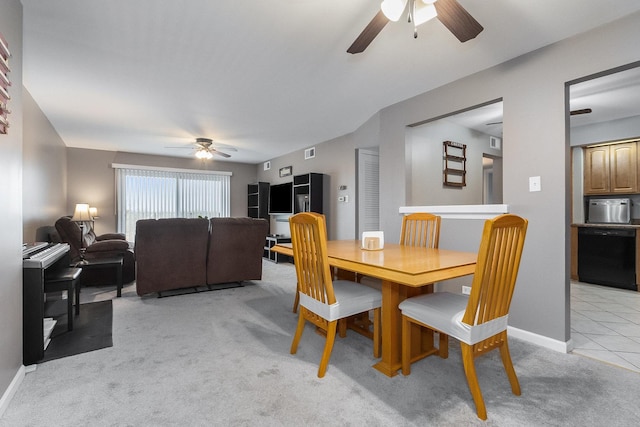 carpeted dining area featuring ceiling fan