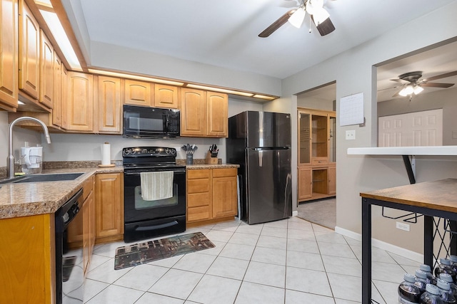 kitchen featuring sink, black appliances, ceiling fan, and light tile patterned flooring