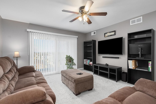 carpeted living room featuring ceiling fan