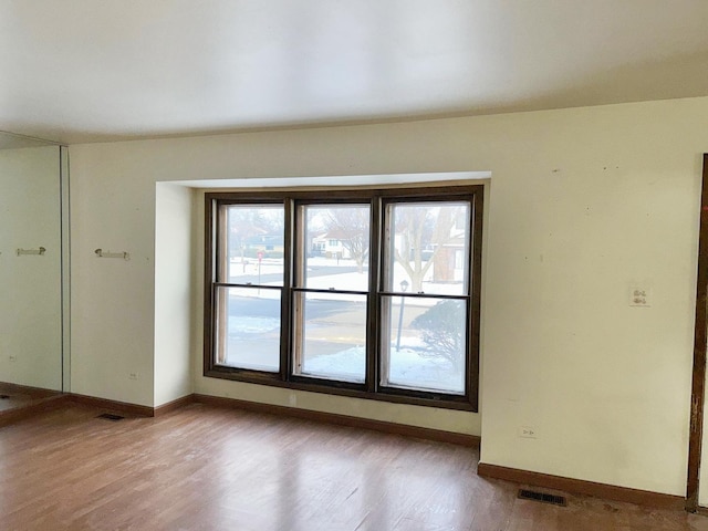 spare room featuring light hardwood / wood-style flooring