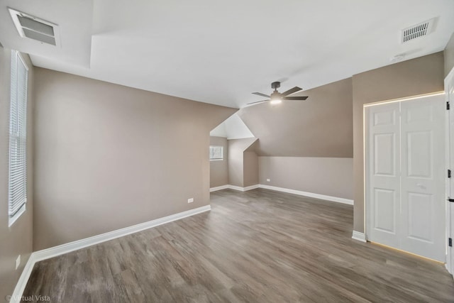 additional living space featuring ceiling fan, hardwood / wood-style floors, and lofted ceiling