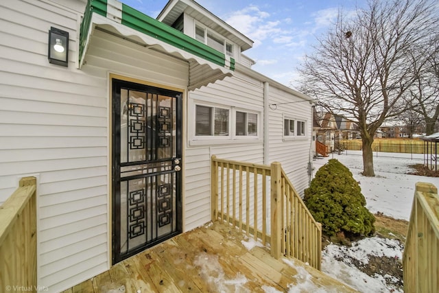 view of snow covered property entrance