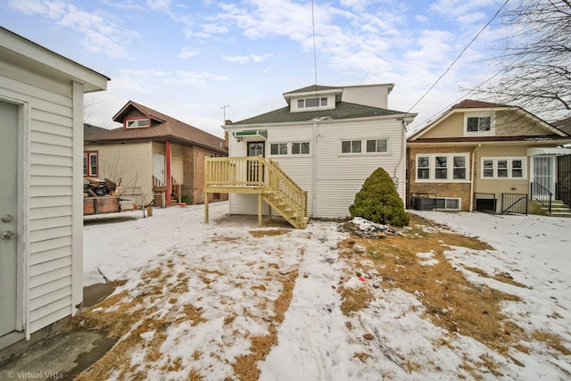 view of snow covered house