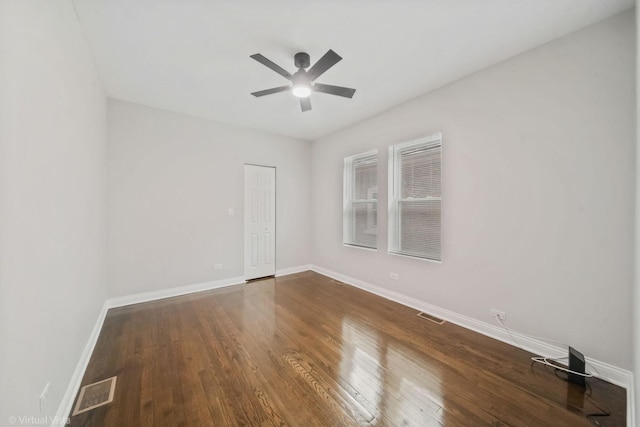 empty room featuring wood-type flooring and ceiling fan