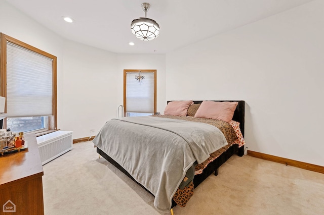 bedroom with light colored carpet