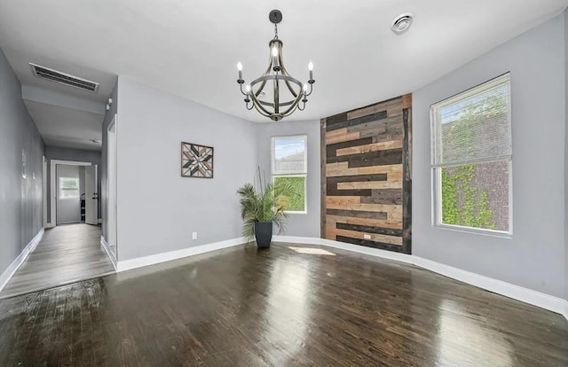 interior space featuring plenty of natural light and dark hardwood / wood-style flooring