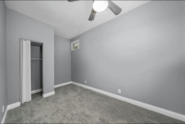 unfurnished bedroom featuring ceiling fan, a closet, and light carpet