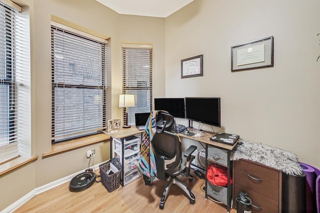 office area with hardwood / wood-style flooring and plenty of natural light