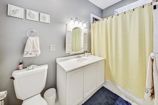 bathroom with vanity, toilet, tile patterned floors, and a shower with curtain