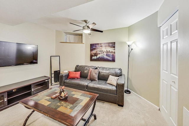 carpeted living room featuring ceiling fan