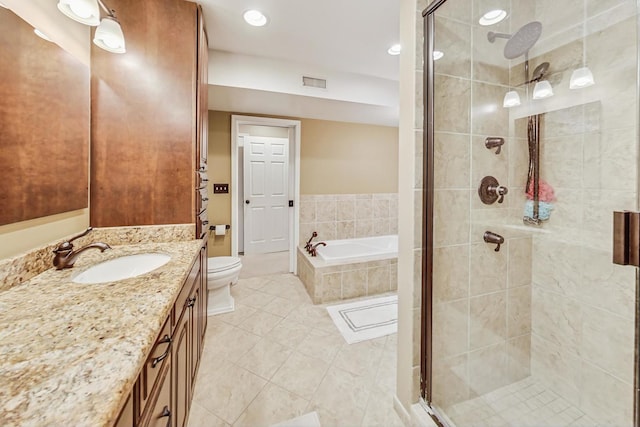 full bathroom featuring toilet, tile patterned flooring, shower with separate bathtub, and vanity