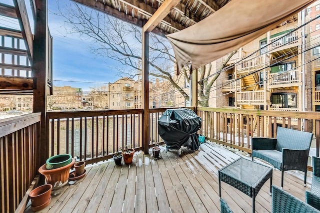 wooden deck featuring grilling area