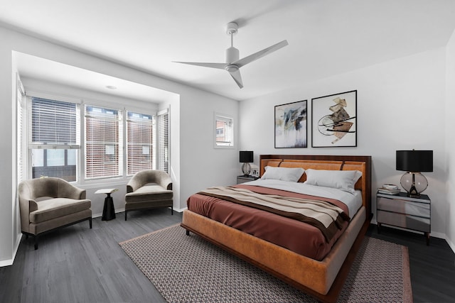 bedroom with dark wood-type flooring and ceiling fan