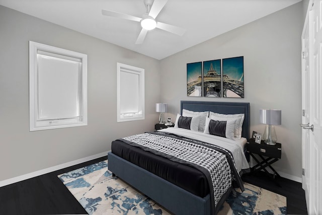 bedroom with hardwood / wood-style flooring, lofted ceiling, and ceiling fan