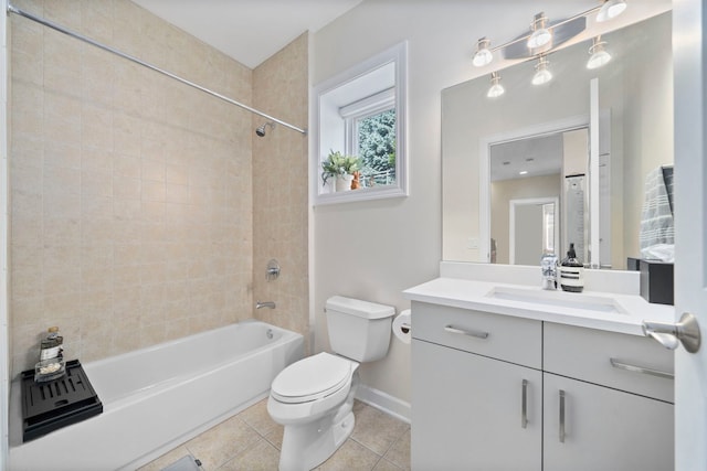 full bathroom featuring tile patterned flooring, vanity, tiled shower / bath combo, and toilet