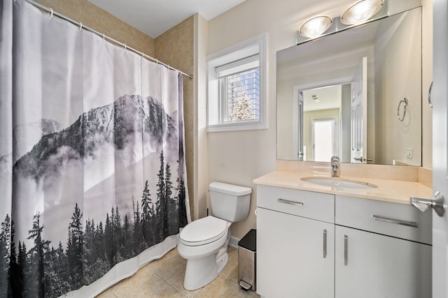 bathroom with tile patterned floors, toilet, and vanity