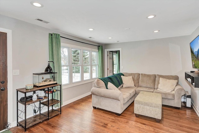 living room with light hardwood / wood-style floors