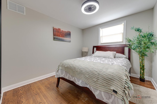 bedroom with wood-type flooring