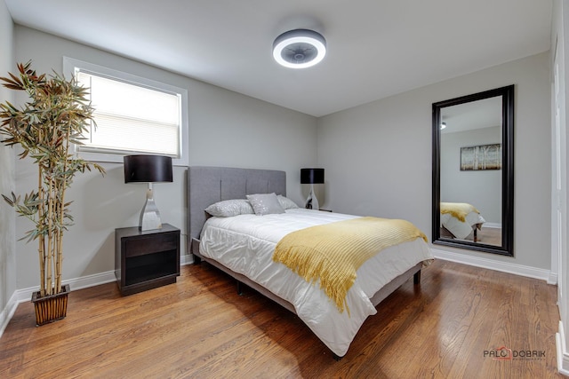 bedroom with hardwood / wood-style flooring