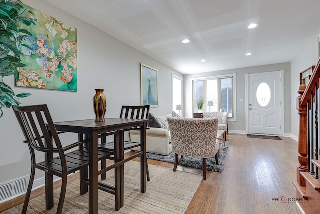 dining area with wood-type flooring