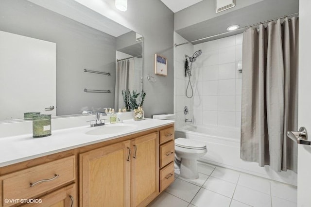 full bathroom with vanity, toilet, tile patterned floors, and shower / tub combo with curtain