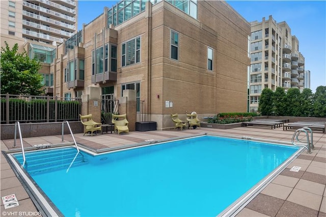 view of swimming pool featuring a patio area