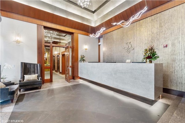 reception area featuring an inviting chandelier