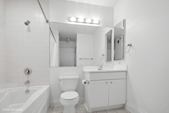 full bathroom featuring tile patterned floors, toilet, vanity, and tiled shower / bath