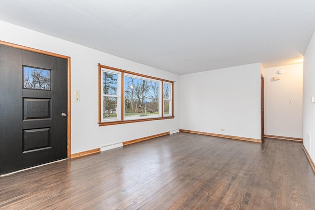 foyer entrance with dark hardwood / wood-style flooring