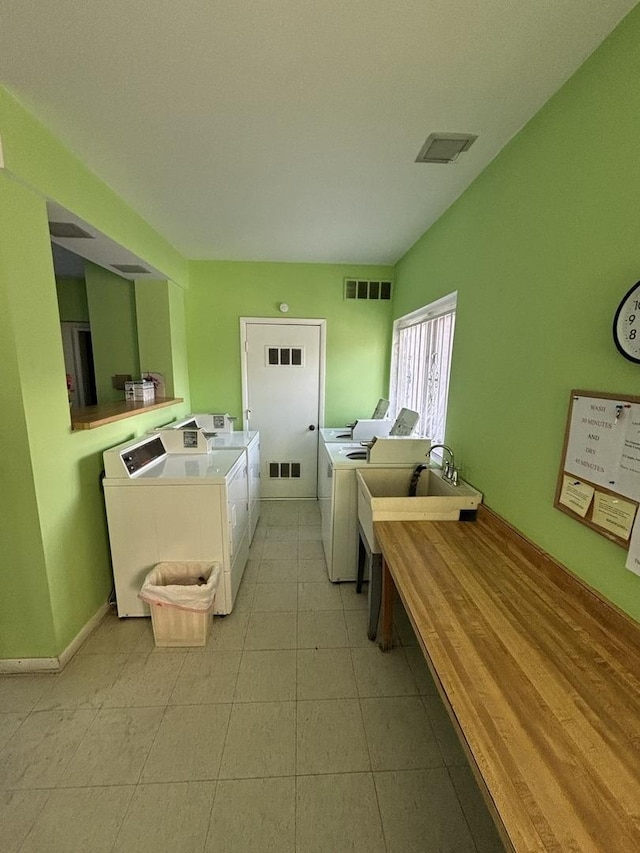 laundry room with independent washer and dryer