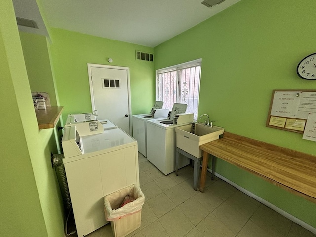 laundry room with sink and washing machine and clothes dryer