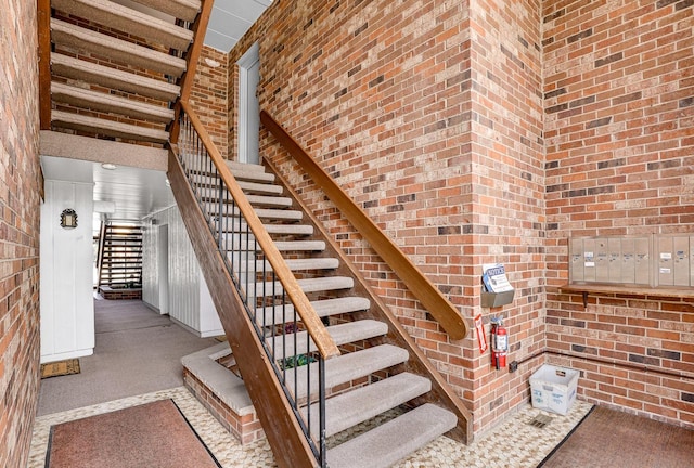 staircase featuring a high ceiling