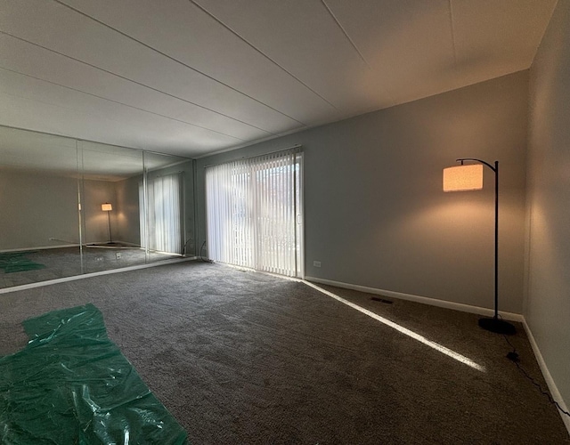 empty room featuring carpet flooring