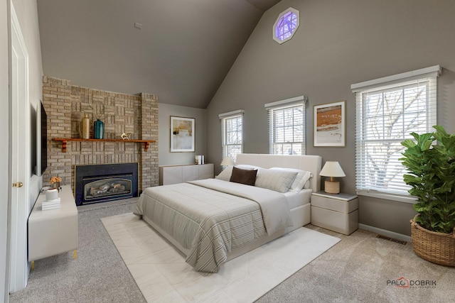 bedroom with carpet, visible vents, baseboards, high vaulted ceiling, and a fireplace