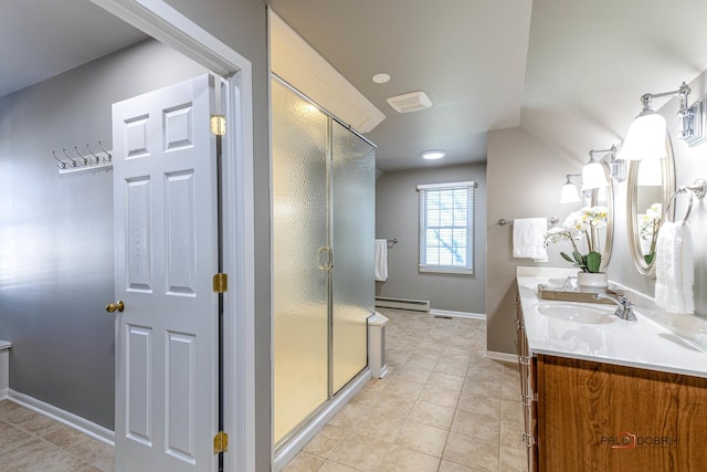 full bathroom with vanity, baseboards, a stall shower, tile patterned flooring, and a baseboard heating unit